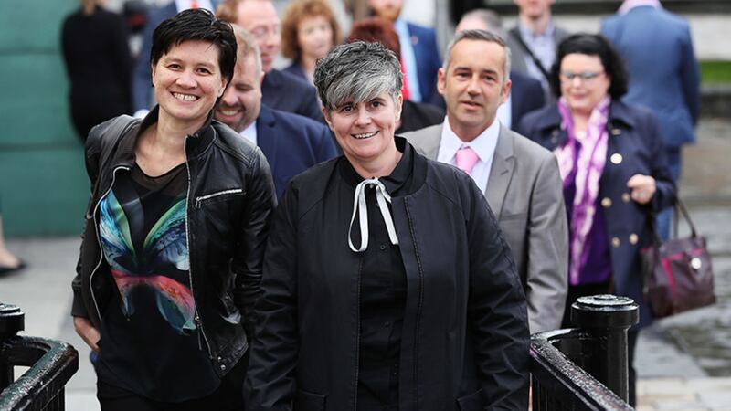 Civil partners Shannon Sickles (left) and Grainne Close arriving at the High Court in Belfast ahead of the judgement on two landmark legal challenges against Northern Ireland's ban on gay marriage&nbsp;