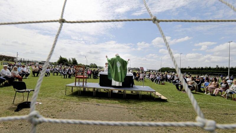 Fr Colm McBride held Mass on the Glenavy pitch. Picture by Hugh Russell 