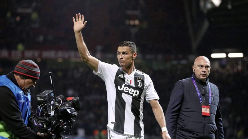 Juventus&#39; Cristiano Ronaldo waves to the Manchester United fans on his latest return to Old Trafford 