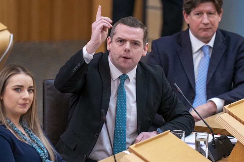 The First Minister was questioned on the Act by Scottish Tory leader Douglas Ross