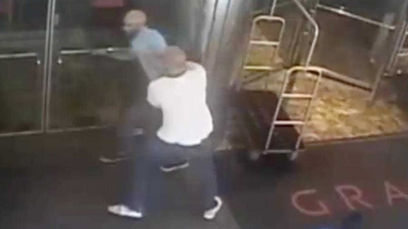 This image taken from a surveillance camera and released by the New York Police Department shows former tennis star James Blake, top left, being arrested by plainclothes officer James Frascatore outside of the Grand Hyatt New York hotel on Wednesday 