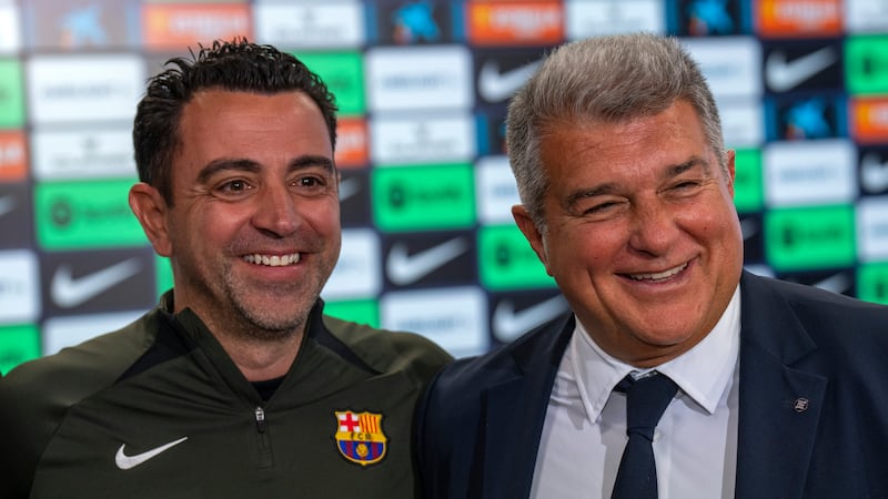 Barcelona head coach Xavi and president Joan Laporta during a press conference (Emilio Morenatti/AP)