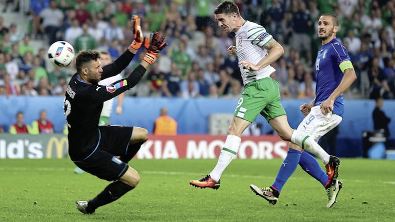 The Republic of Ireland's Robbie Brady scores the famous goal to sink Italy in Lille at Euro 2016