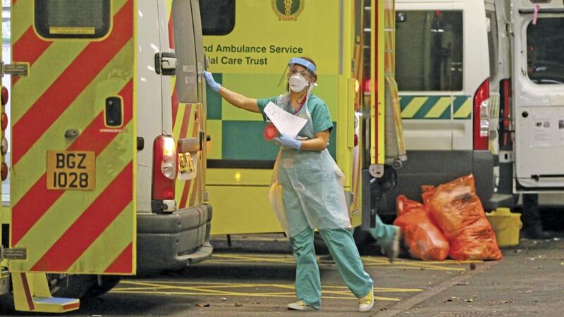 Ambulances queued up outside Antrim Area Hospital last month as patients waited up to 12 hours for admission laid bare the impact of Covid on an already under-resourced health system. Picture Mal McCann. 