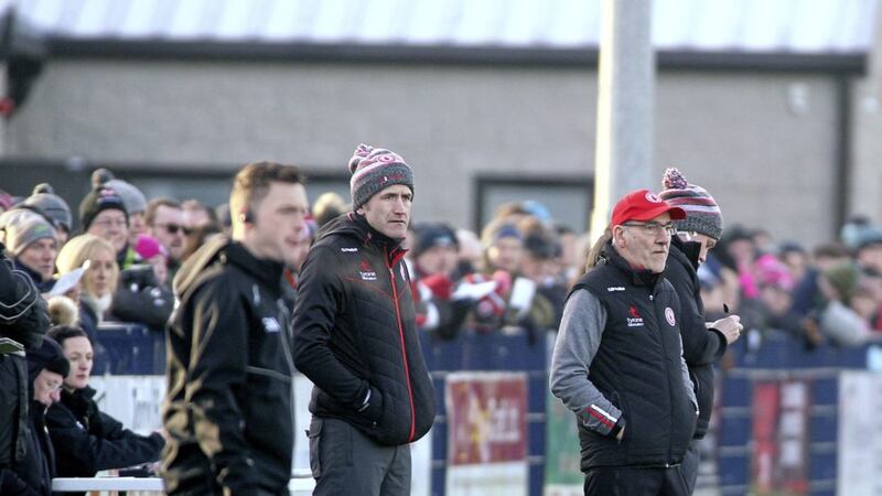 Stephen O'Neill (second from left) watches Tyrone against St Mary's alongside manager Mickey Harte and assistant boss Gavin Devlin. Pic Seamus Loughran
