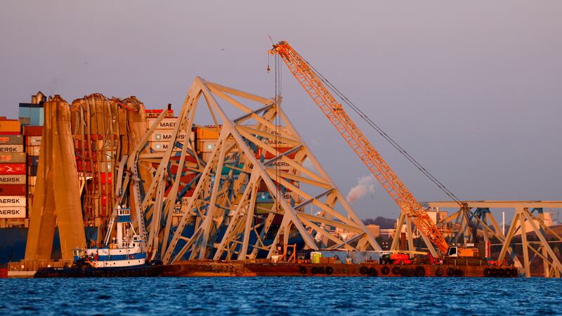 Cranes are being used to lift the wreckage of the Francis Scott Key Bridge (Julia Nikhinson/AP)