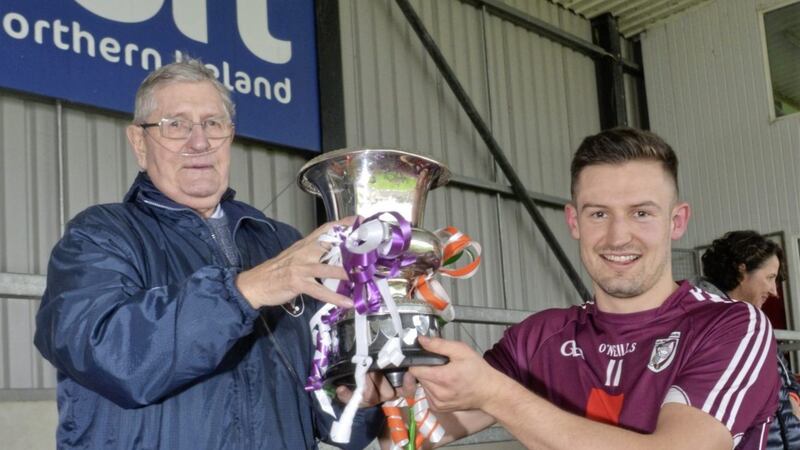 Bredagh president Jim O&#39;Keefe pictured with club captain Donal Hughes after the South Belfast Gaels captured the Down Intermediate Football Championship title last year 