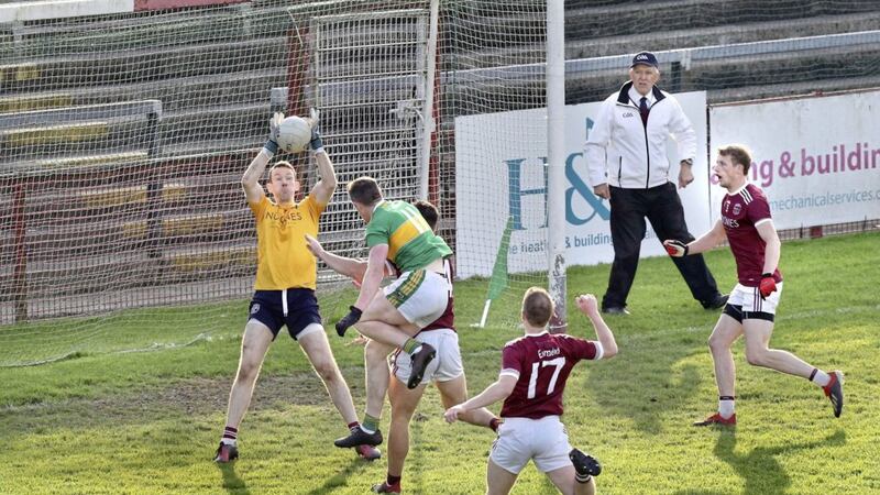 Slaughtneil goalkeeper Antoin McMullan makes a crucial last-minute save from Emmett Bradley that saw the Emmet&#39;s past Glen in the Derry SFC quarter-final. They face Slaughtneil in the final on Sunday. Picture by Margaret McLaughlin 