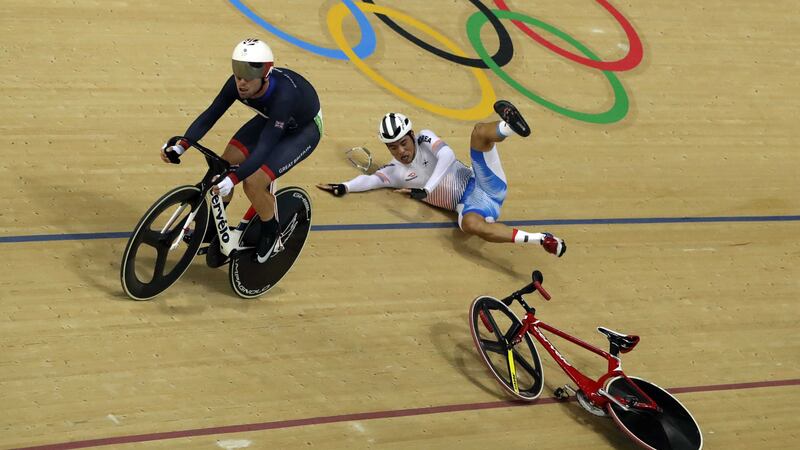 Park Sang-Hoon of South Korea goes flying after being involved in a crash with Mark Cavendish during the omnium points race<br />Picture by AP
