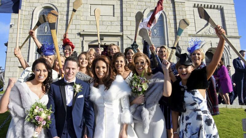 Antrim hurler Arron Graffin and Down Camog Sara-Louise Carr exchanged vows in front of family, friends and teammates at St John&rsquo;s Church in Hilltown, Co Down. Picture by Brendan Monaghan 