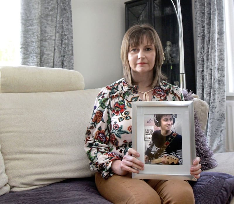 Niamh Dolan with a photo of her late son Enda at the family home in Killyclogher Picture: Margaret McLaughlin 