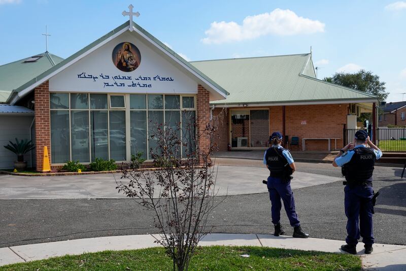 Australian police say the knife attack in Sydney that wounded a bishop and a priest during a church service was an act of terrorism (AP Photo/Mark Baker)