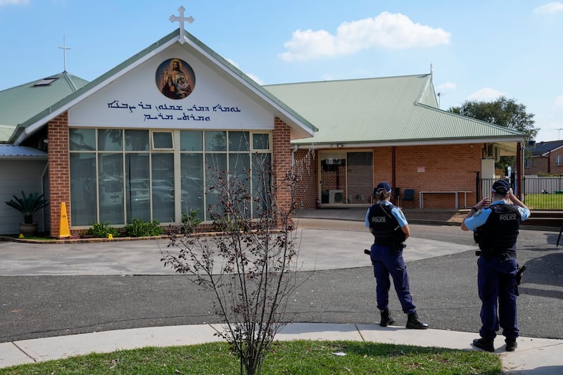 Police patrol outside the Christ the Good Shepherd church in suburban Wakely in western Sydney (Mark Baker/AP)