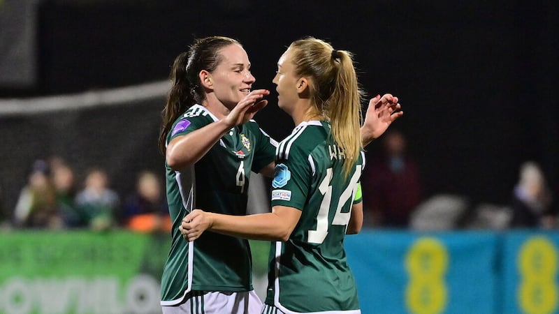 Sarah McFadden (left) congratulates Lauren Wade on scoring for Northern Ireland against Albania.