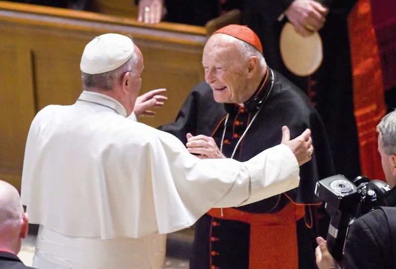 In a file picture from September 2015, Pope Francis reaches out to hug Theodore McCarrick. The Vatican has taken the extraordinary step of publishing its two-year investigation into the disgraced ex-cardinal, who was defrocked last year after the Vatican determined that years of rumours that he was a sexual predator were true. Picture by Jonathan Newton/The Washington Post via AP, File 