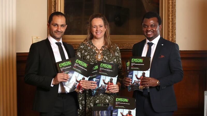 Mohamed Chendali, EMSONI secretary, and Adekanmi Abayomi, founder and chair of EMSONI flank Belfast Lord Mayor Kate Nicholl at the launchn of the Ethnic Minority Sports Leadership Summit report at the City Hall.<br />Picture: Declan Roughan