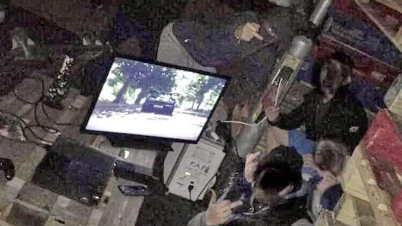 A photograph which emerged on social media shows a gang with a TV and X-Box wired into a street light. The post said those gathered were also armed with petrol bombs 