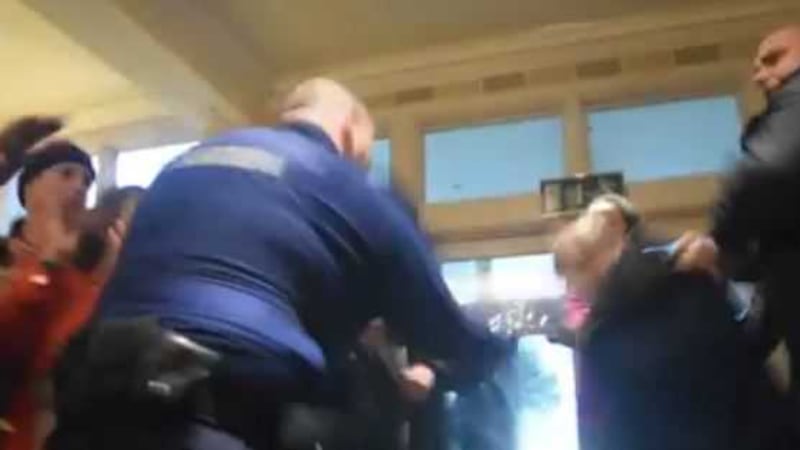 The video shows a garda striking an elderly man with a baton. (Screenshot from video by An Spr&eacute;ach/John Rooney)&nbsp;