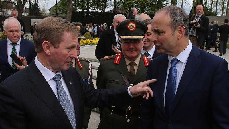 Acting Taoiseach Enda Kenny (left) chats with Fianna Fail leader Micheal Martin during centenary of the 1916 Easter Rising leaders at Arbour Hill Cemetery, Dublin in April 