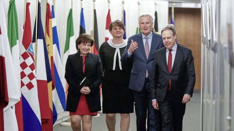 Leader of the Democratic Unionist Party Arlene Foster, center left, speaks with European Union chief Brexit negotiator Michel Barnier, center right, prior to a meeting at EU headquarters in Brussels on Tuesday, March 6, 2018. (Yves Herman, Pool Photo via AP). 