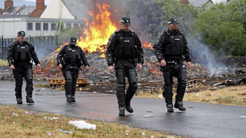 Police at a bonfire at Bloomfield Walkway in east Belfast last month. Picture by Mal McCann 