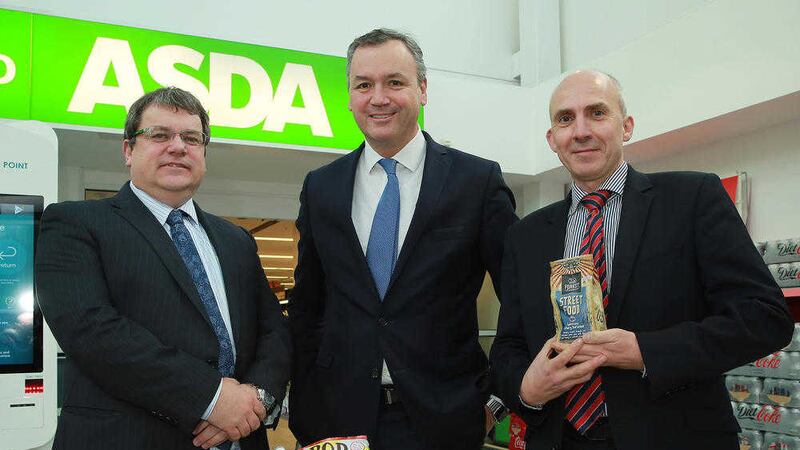 Asda CEO Andy Clarke, centre, with Michael McCallion, Asda senior buying manager Scotland and NI, left and Tim McVicker, Forest Feast 
