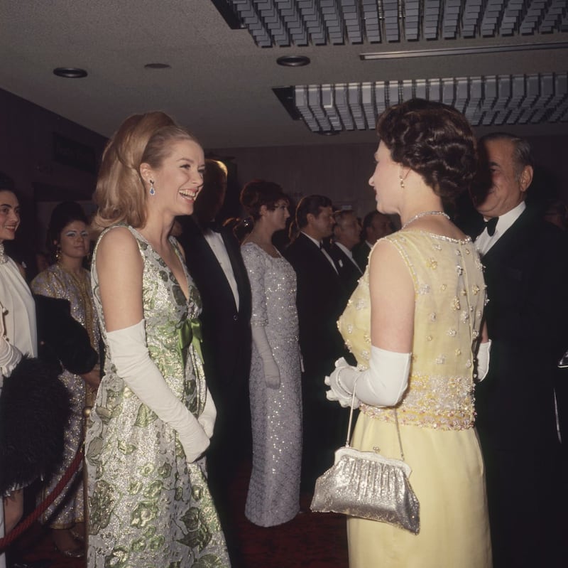 Queen Elizabeth II talking to actress Sally Ann Howes, who starred alongside Terry Carter in musical Kwamina on Broadway