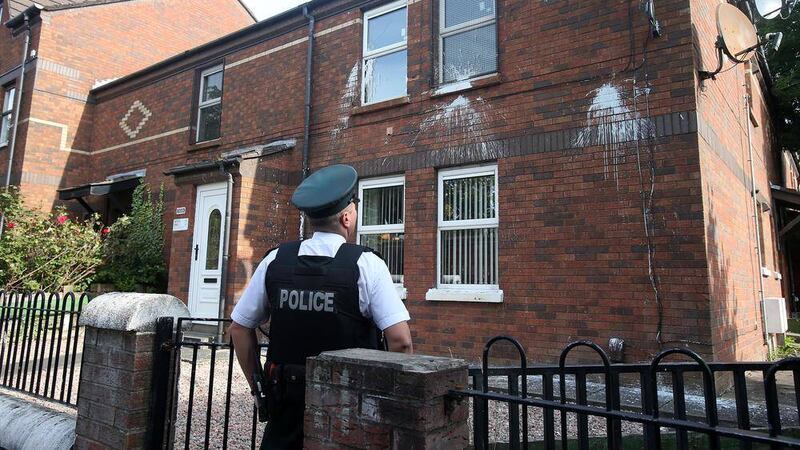 Police at the scene in Ardoyne where homes were attacked with paint. Picture by Mal McCann. 
