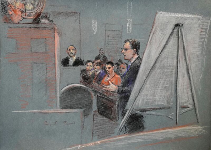 Jack Teixeira, centre, is seated as defence lawyer Brendan Kelley stands and speaks