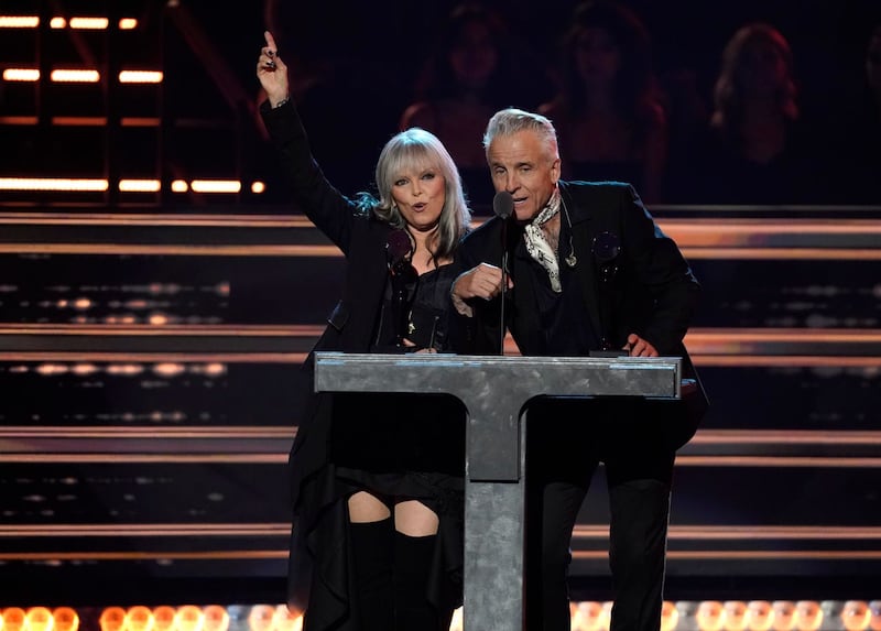 Inductees Pat Benatar, left, and Neil Giraldo speak during the Rock & Roll Hall of Fame Induction Ceremony at the Microsoft Theatre in Los Angeles