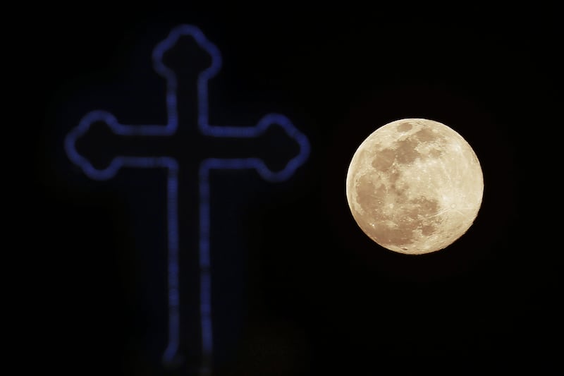 <span style="font-family: Verdana, Arial, Helvetica, sans-serif; font-size: 13.3333px;">The Easter story is one of light overcoming darkness. Pictured is the cross of a Christian Orthodox church in Nicosia, Cyprus against the backdrop of this week's 'supermoon'. Picture by&nbsp;</span><span style="font-family: Verdana, Arial, Helvetica, sans-serif; font-size: 13.3333px;">AP Photo/Petros Karadjias</span>