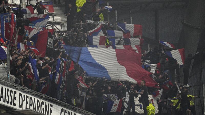 Lyon fans in the stadium (Daniel Cole/AP)