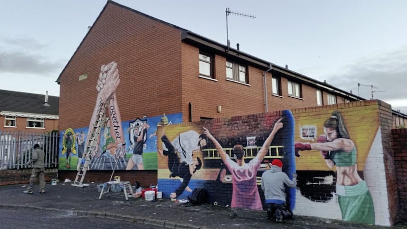 The finishing touches are put on the Havana Street Youth Mural project last month, whose aim is celebrate young people in the Ardoyne area of north Belfast 