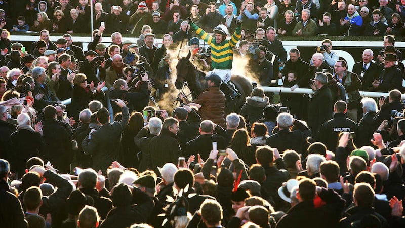 Tony McCoy enters the parade ring aboard Carlingford Lough after winning the Hennessy Gold Cup at Leopardstown in April