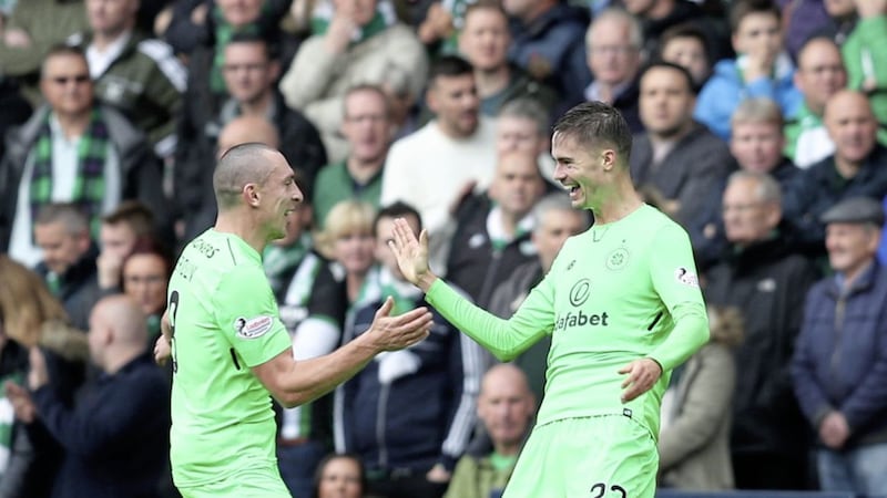 Celtic skipper celebrates with Mikael Lustig after the Swede opened the scoring during the 4-2 win over Hibernian in the Betfred Cup semi-final at Hampden Park on Saturday Picture: PA 