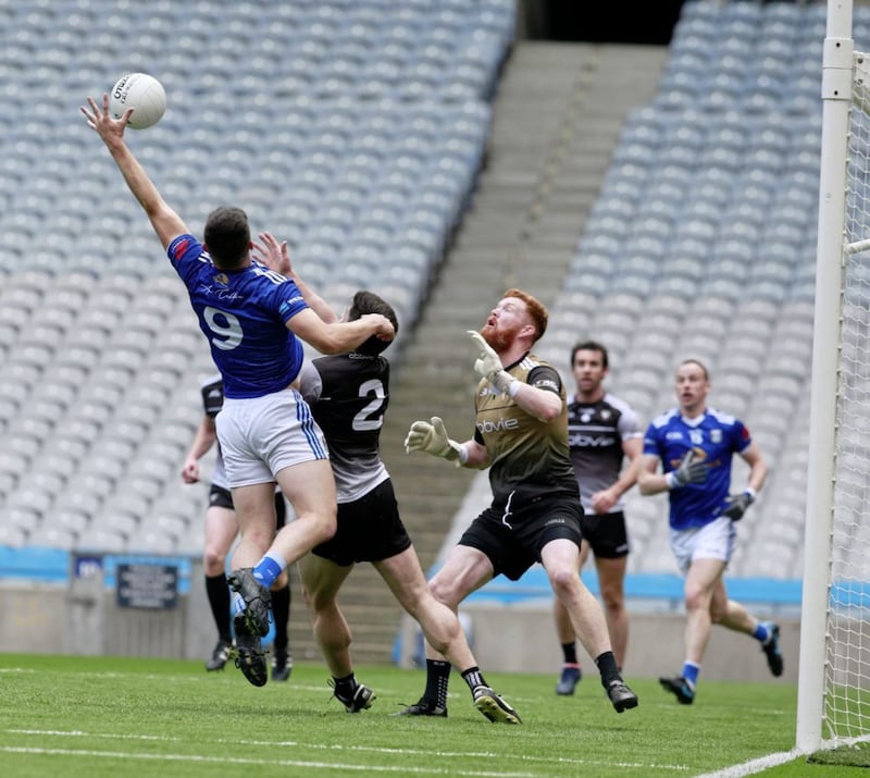 Cavan's James Smith and Sligo's Aiden Devaney and Hathan Mullen in yesterday's Tailteann Cup semi-final Picture: Philip Walsh.