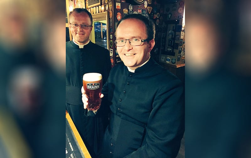 Reverend Rob James with a pint of Reverend James by Brain's. Picture from&nbsp;PA Wire