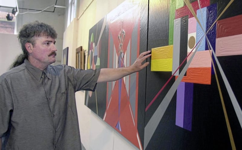 Michael Stone in 2001 with some of his work painted in the Maze Prison at an exhibition of his work in the Engine Room Gallery on Belfast&#39;s Newtownards Road.Picture by Pacemaker 