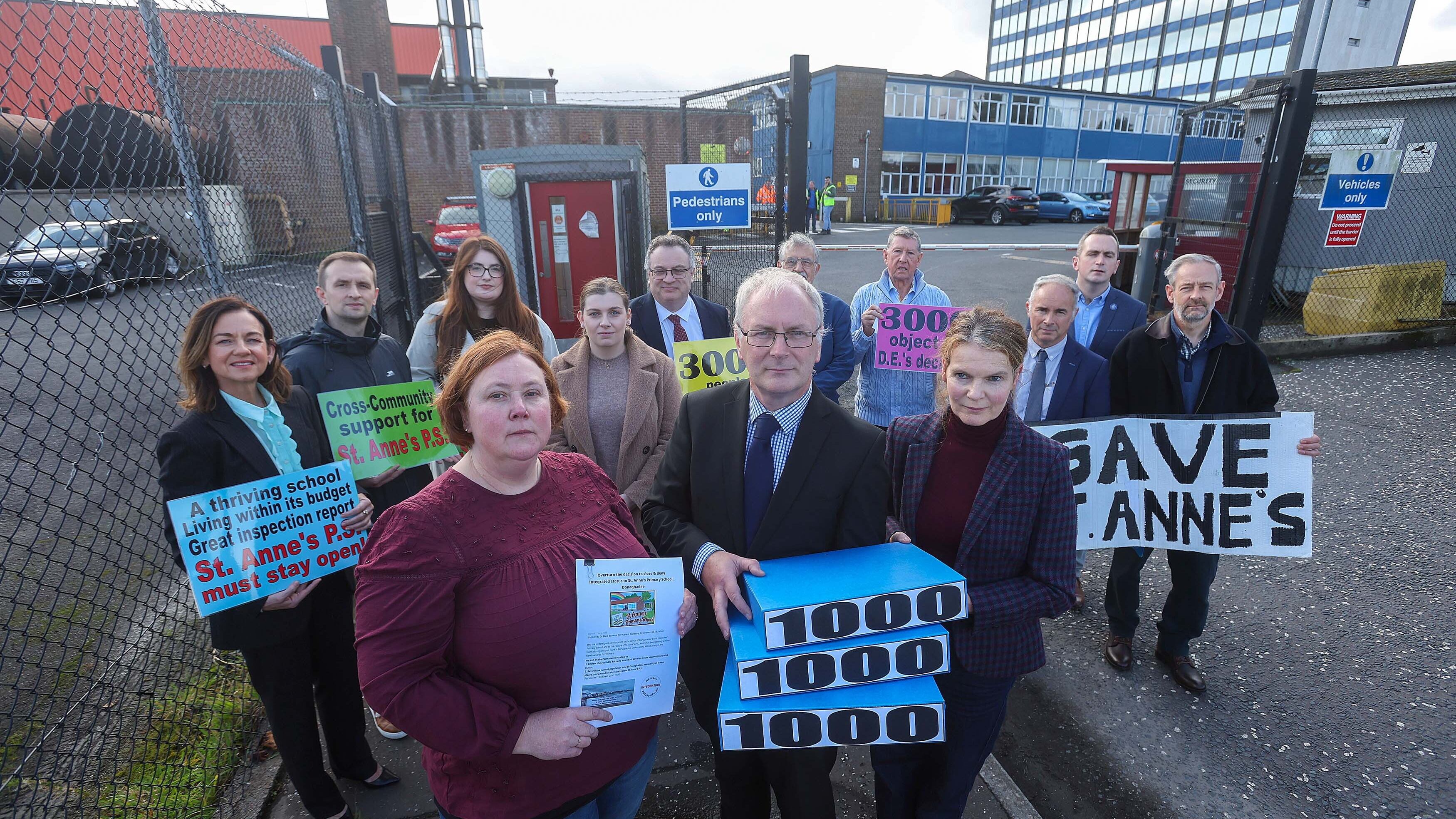 John Hennessy, principal of St Anne's PS, Donaghadee with elected members and supporters delivering a petition objecting to the closure of the school. Picture by Mal McCann