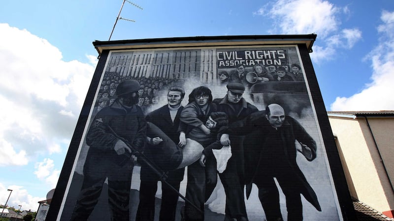 A mural in the Bogside area of Derry depicting Edward Daly waving a white handkerchief as he led Jackie Duddy away from danger on Bloody Sunday. Picture by Paul Faith, Press Association&nbsp;