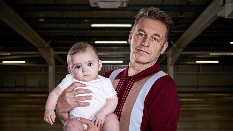 Chris Packham with one of the new additions to the 7.7 billion people in the world. (C) Curious Films - Photographer: Adam Lawrence 