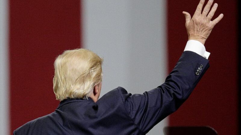 President Donald Trump waves goodbye to the crowd after he speaks at a campaign rally in support of Senator Luther Strange, in Huntsville on Friday. Picture by Brynn Anderson, Associated Press 
