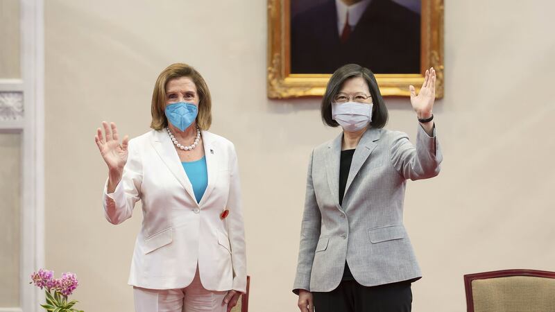 US House Speaker Nancy Pelosi (left) and Taiwanese President President Tsai Ing-wen wave during a meeting in Taipei, Taiwan, Wednesday, Aug. 3, 2022. Ms Pelosi, meeting top officials in Taiwan despite warnings from China, said Wednesday that she and other congressional leaders in a visiting delegation are showing they will not abandon their commitment to the self-governing island. (Taiwan Presidential Office via AP)