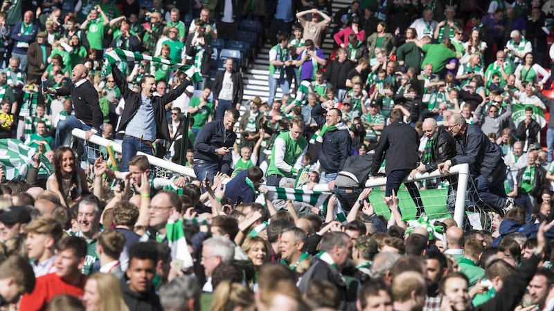 &nbsp;Thousands of Hibernian supporters stormed the pitch at Hampden after the final whistle, forcing the players and staff off the pitch<br />Picture by PA