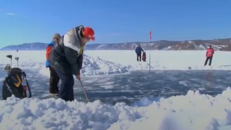 It's an icy tee-off! Watch golfers play on a frozen lake in Siberia for world tournament