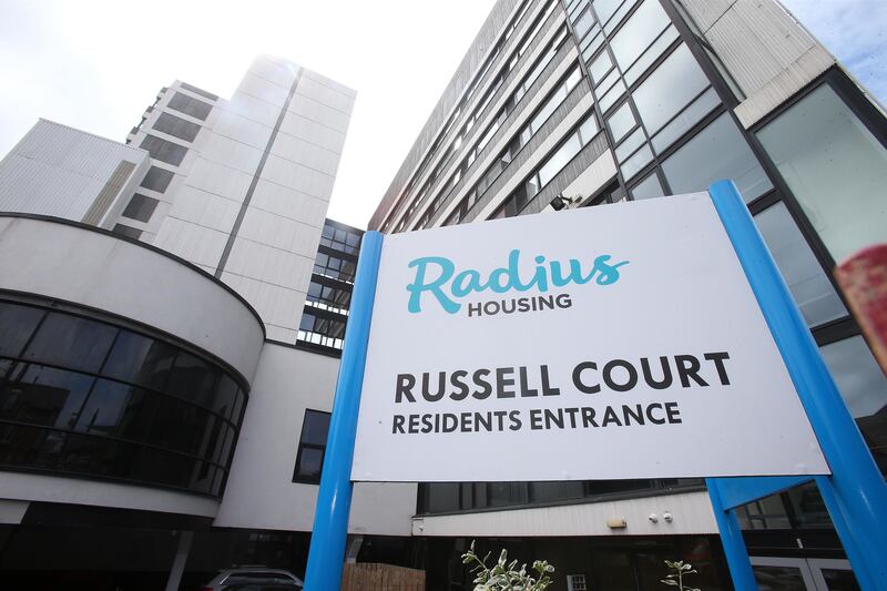&nbsp;A woman jumped to safety after fire broke out at the Russell Court building in south Belfast.