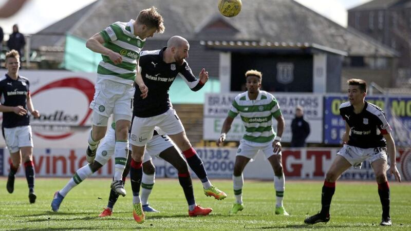 MERRY ARMSTRONG: Celtic&rsquo;s Stuart Armstrong powers home a header for his side&rsquo;s second goal in their 2-1 victory over Dundee yesterday						 	  Picture: PA 
