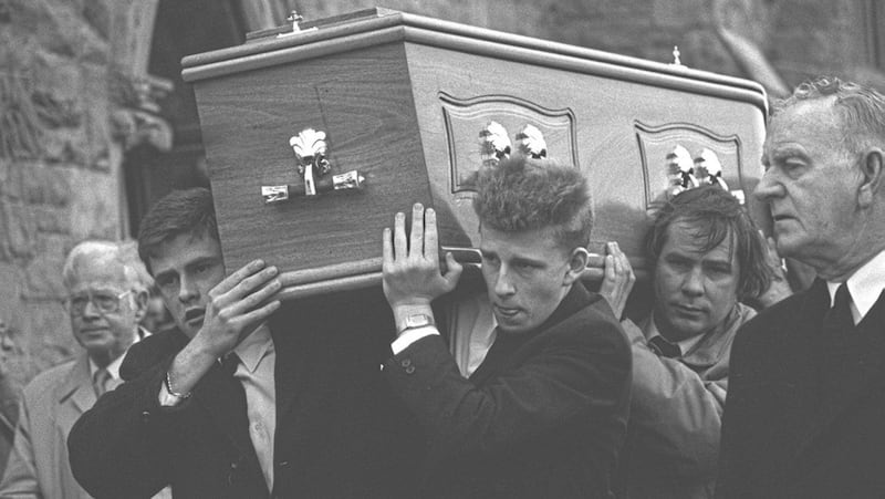Patrick Kielty carrying his father&#39;s coffin at his funeral at Dundrum Sacred Heart Catholic Church in January 1988 