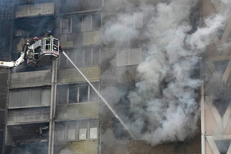 Firefighters work to extinguish a fire in an apartment building after a Russian attack in Kyiv, Ukraine (Efrem Lukatsky/AP)