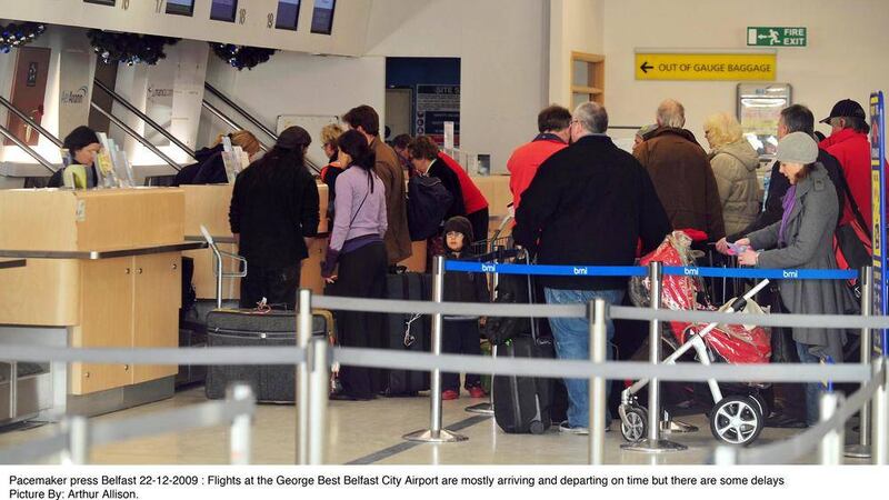 Passengers queuing at George Best Belfast City Airport where 66 people were eligible for compensation for delays between June and September last year